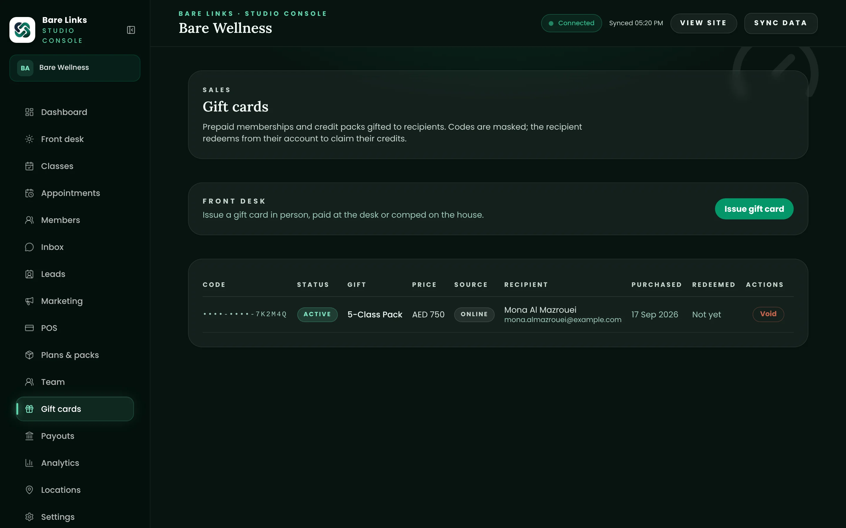 The gift cards screen: a masked code for a 5-class pack bought online, its recipient and a void control, and a button to issue a card at the desk.